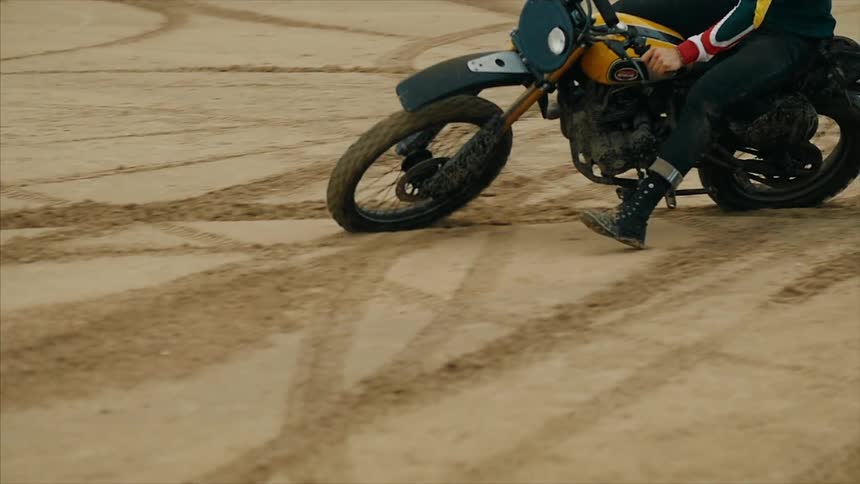 Motorcyclist spinning a circle in the dirt