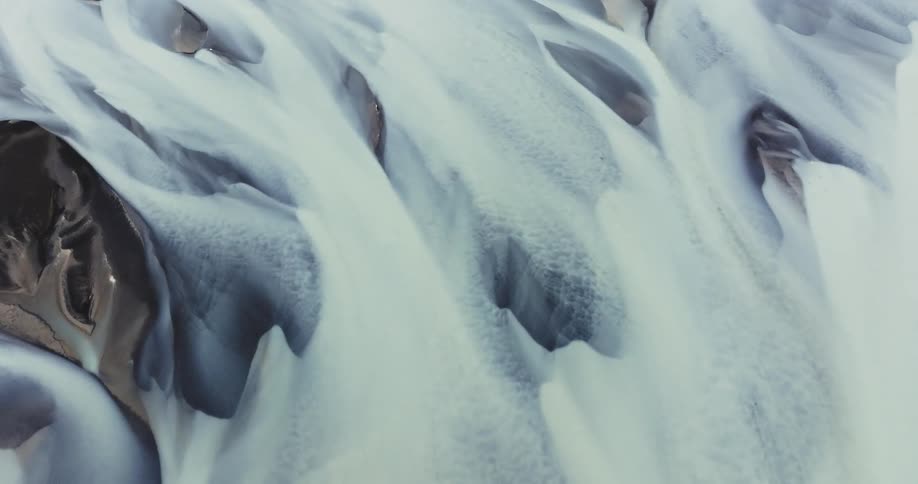 Abstract art of icecapped mountains next to a grassy ground