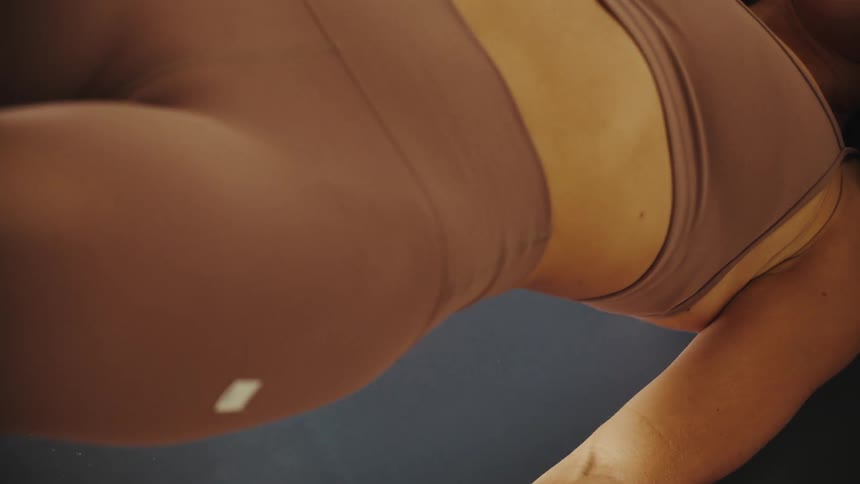 Woman stretching her body lifting her abdomen and buttocks upward