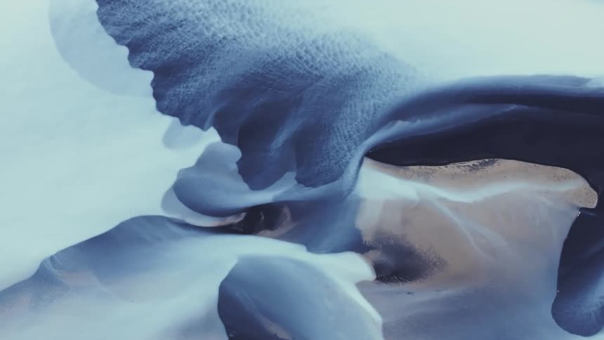 An aerial view of an icelandic river landscape