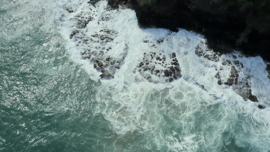 Waves crashing into rocks