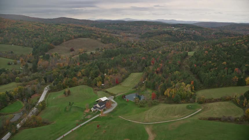 Aerial view of a countryside and an autumn forest
