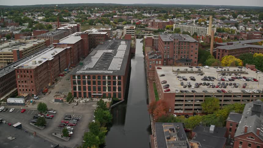 Aerial panorama of an urban city with a central lake