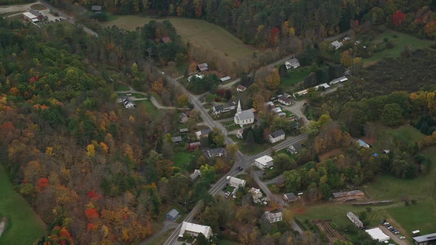 Aerial view of an intersection through a town in the countryside