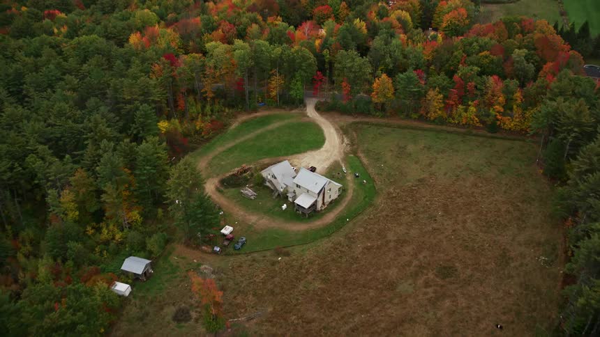Aerial panorama of a house in the midst of a forest
