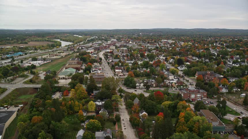 Aerial landscape of an urban city with lakes around and extensive trees and green areas throughout the city