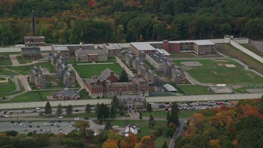 Aerial of apartments in a forested neighborhood