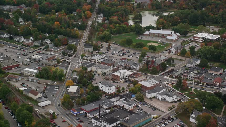 Cars drive through the town