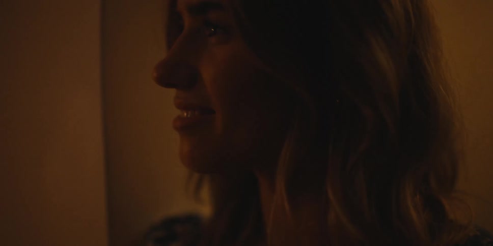 A woman nodding and smiling