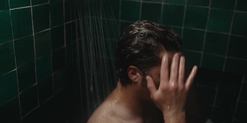 Man washing his hair in the shower