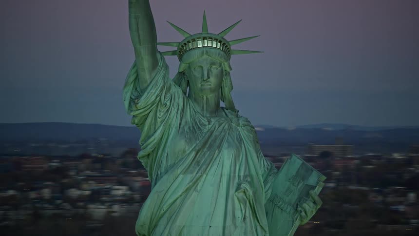 Aerial of the statue of liberty during sunset