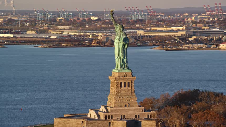 Aerial view of the statue of liberty by the edge of a lake