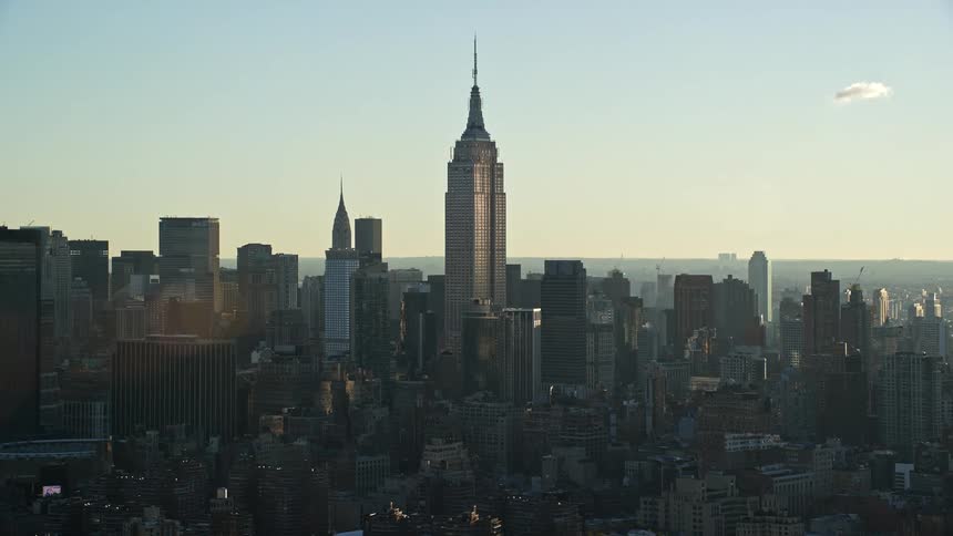 City skyline of empire state building in new york city at dusk