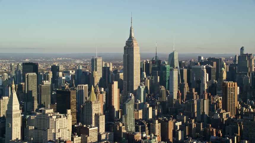 A metropolitan city with a block full of very tall buildings