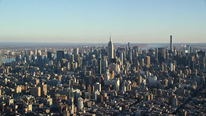 An aerial view of a city skyline with highrise buildings towers and skyscrapers