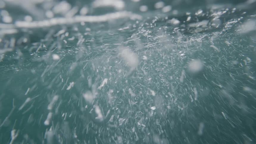 Air bubbles in water with a strong current
