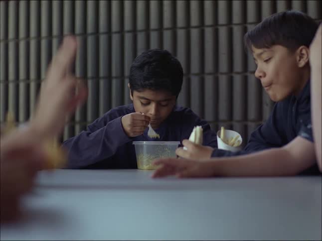 Children sitting at a table eating their snacks