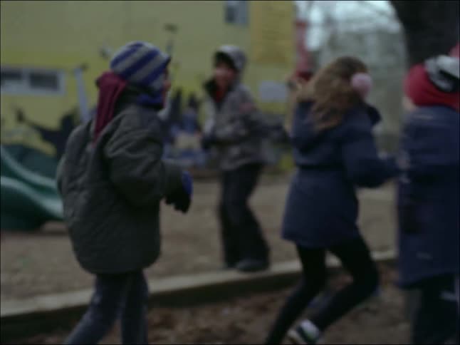 Some kids in the play ground having fun time together