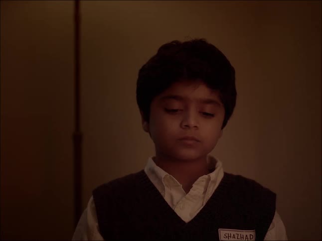 A close up clip of a sad male kid