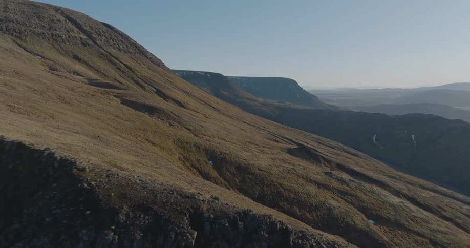 View of mountains and a plateau under a morning sky