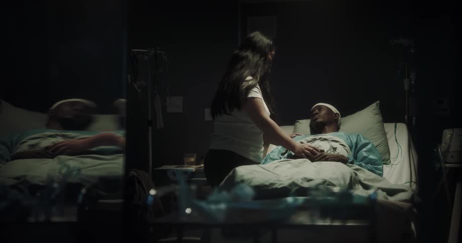 A woman hugs a patient in the hospital