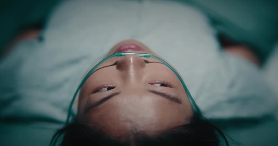 Sleepy woman lying on a hospital stretcher