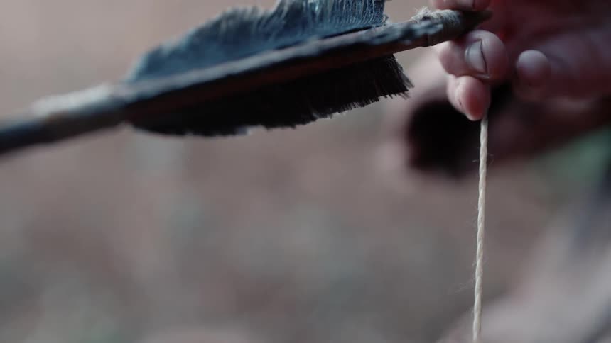 A person shooting a bow and arrow