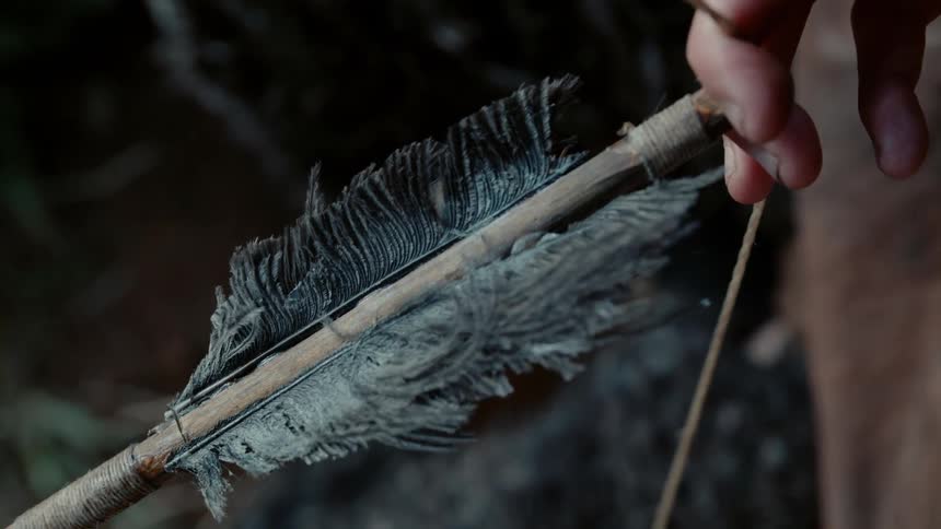 Archer pulling his bow back loaded with an arrow