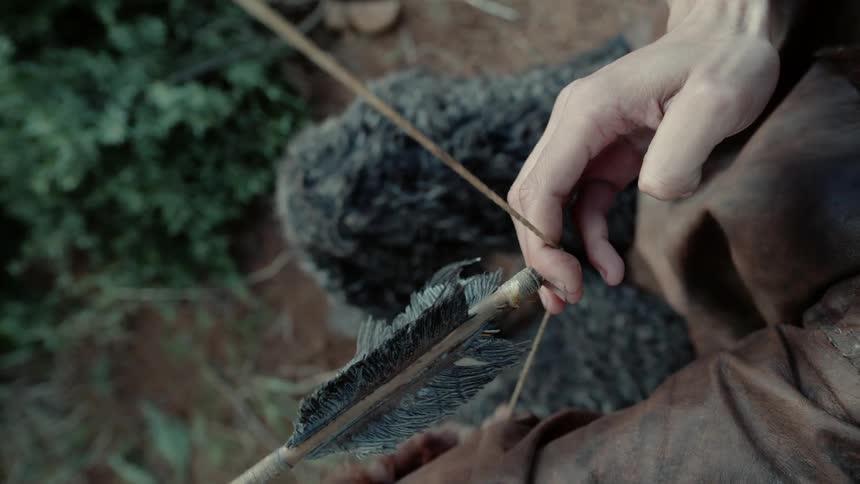 Archer pulling his bow back loaded with an arrow