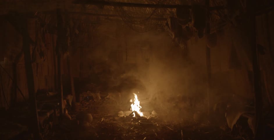 A fire burns in this dark area