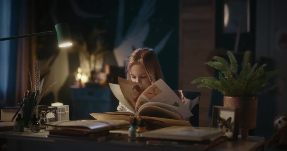 A girl closes a book she was reading