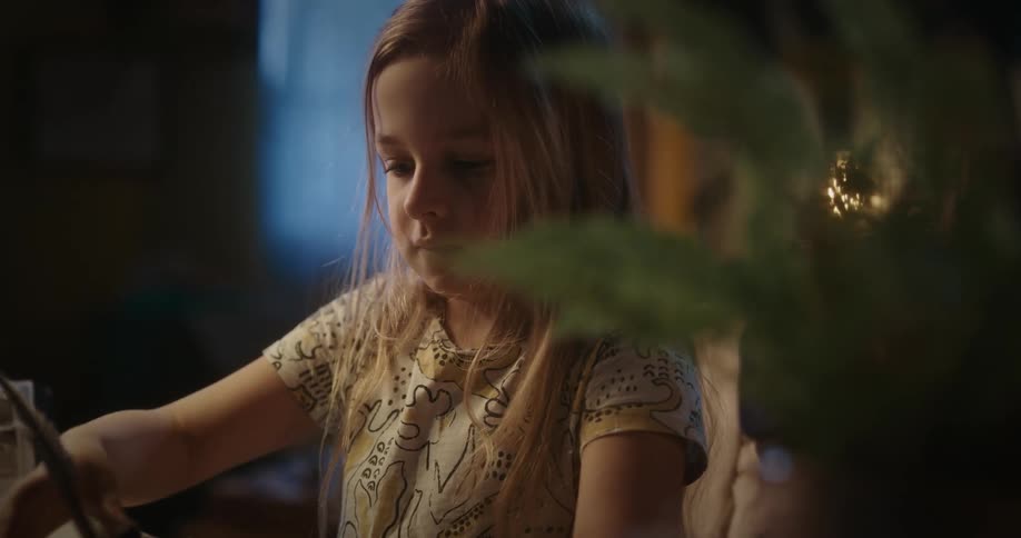 Girl handwriting a letter using quill and ink