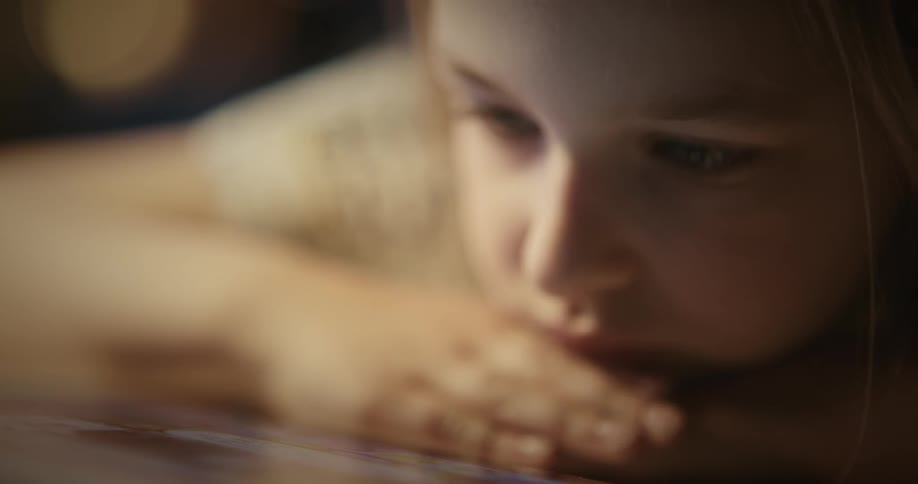 A child is using a tablet
