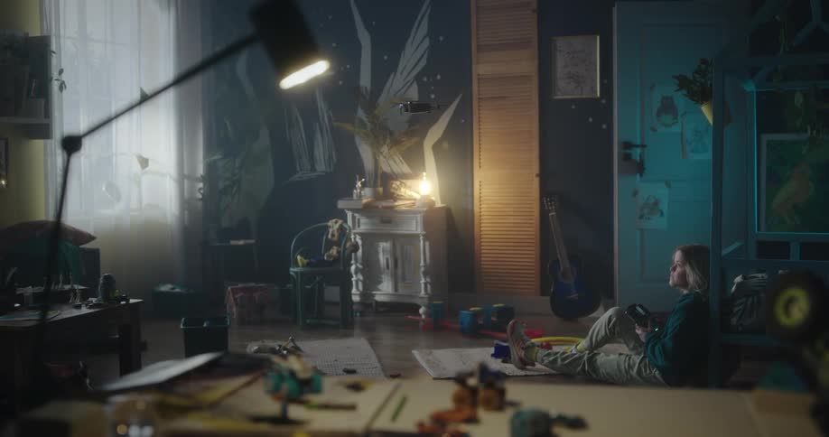 Girl sitting in her room playing with a drone