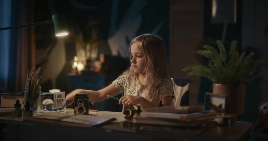 A girl pointing the colored pencils to paint
