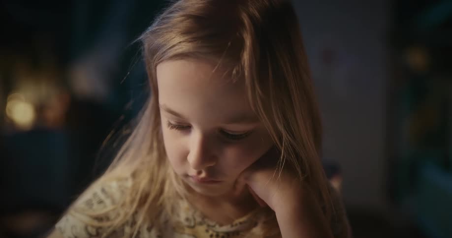 Closeup of the face of a beautiful little blonde girl