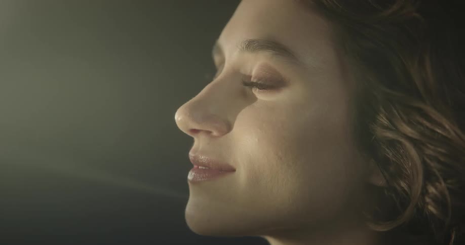 A model wearing makeup and lipstick