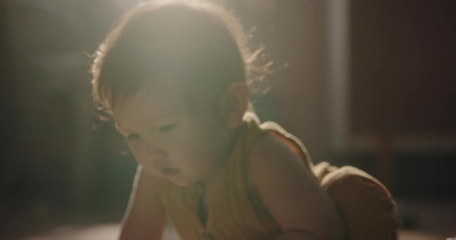 A baby playing on the floor