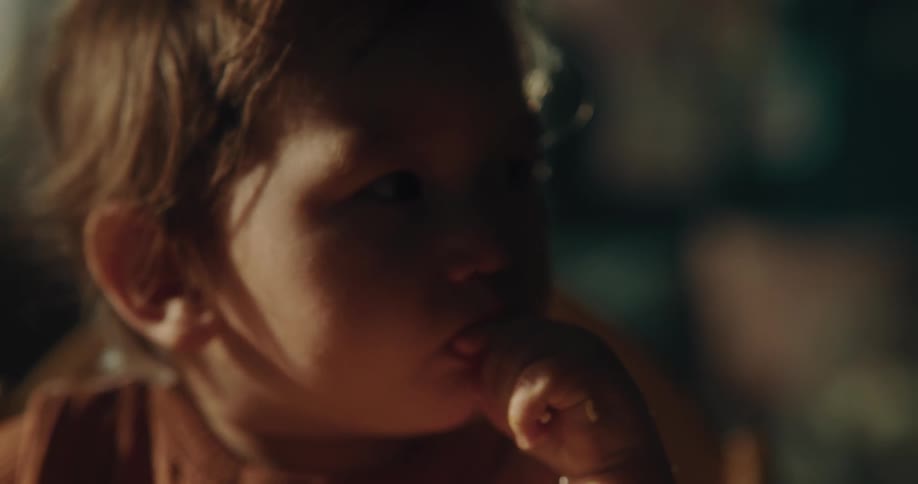 Portrait of a small asian child eating