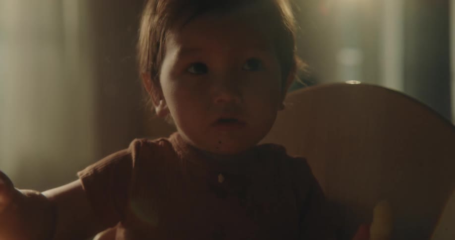 Portrait of a baby sitting and eating food