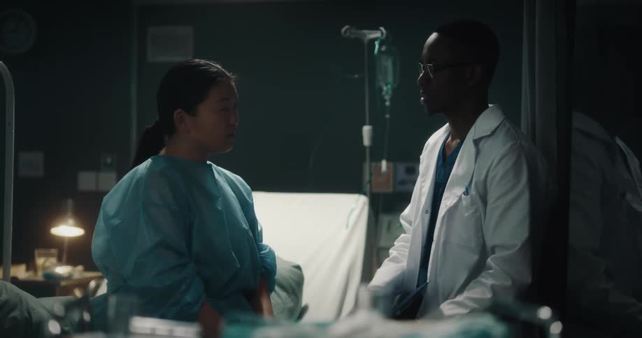Doctor talking to a patient and making some notes