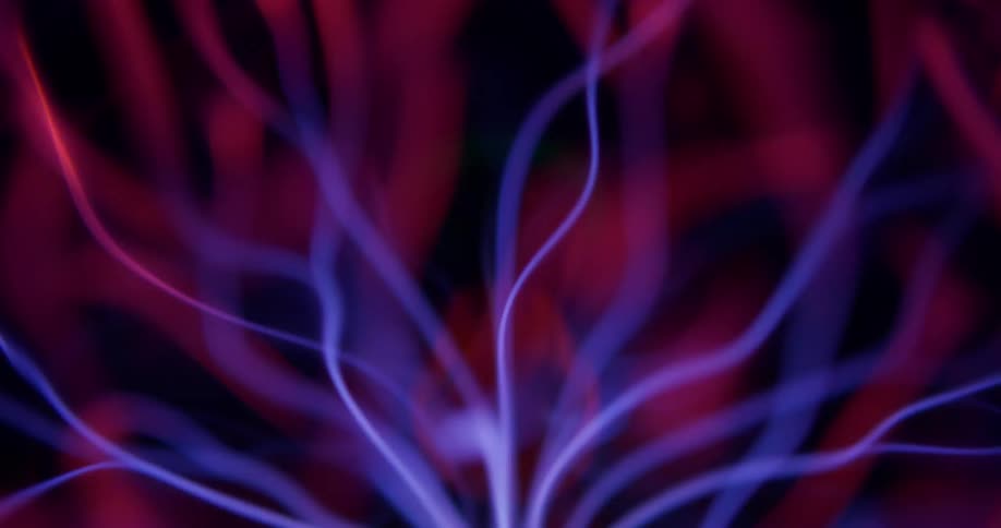 Extreme closeup of abstract purplecolored magnetic waves