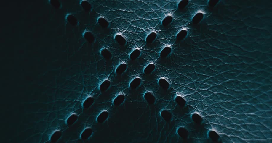 Light brightens on textured surface containing small pattern of holes