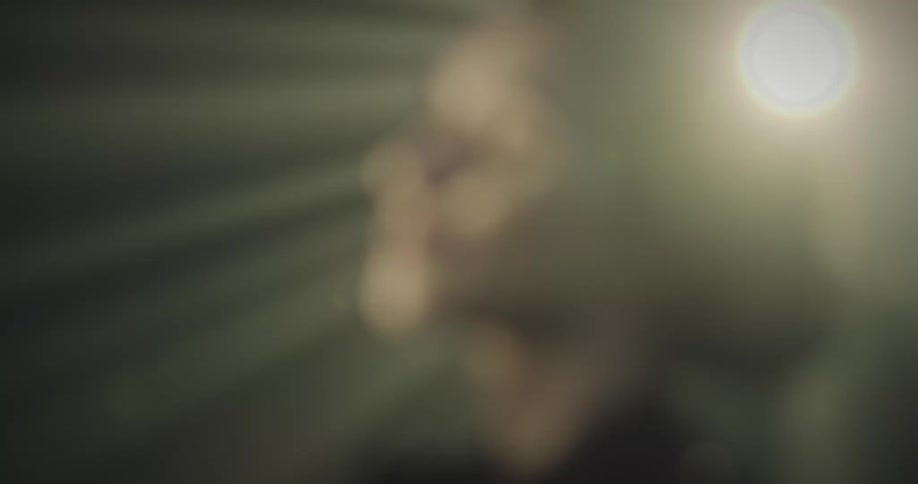 Portrait of a happy woman with lights and reflections passing through her