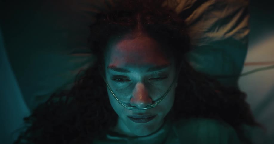 Lady lay on the hospital bed with nasogastric tube in her nose at night