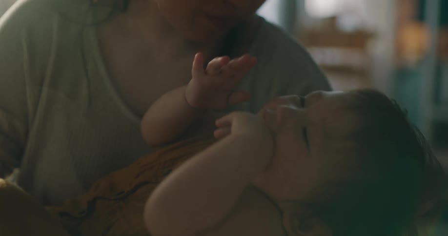 Mother playing with her smiling son