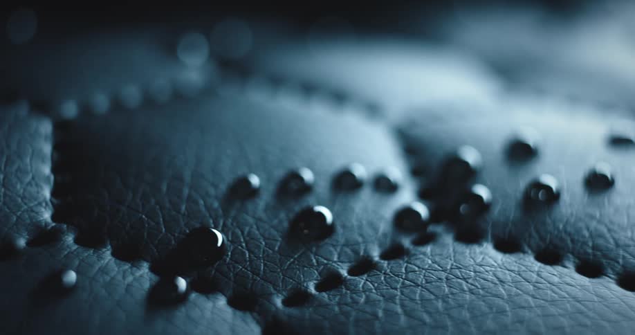 Some black dots on a surface with hexagonal patterns