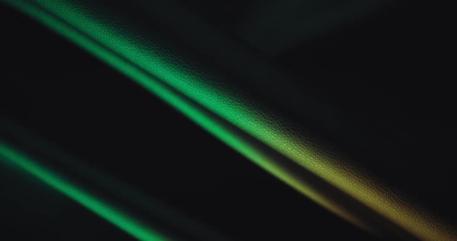 Close up of light and shadows over green fabric