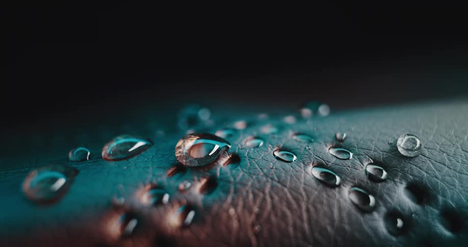 Several drops of water on a leather texture
