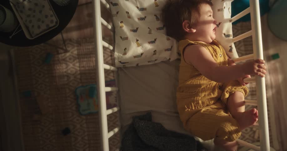 Baby lying in the bed and crying
